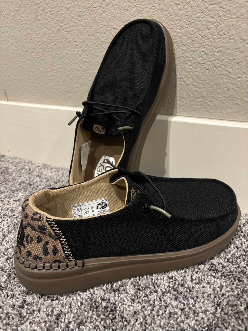 Hey Dude Womens Moccasin Slip-On in Black with Leopard Heel